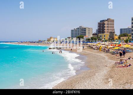 Pebble beach along the western side of the new town of Rhodes Town, Rhodes Island, Dodecanese, Greece Stock Photo