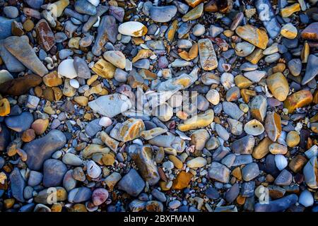 Closeup of pebbles on beach Stock Photo