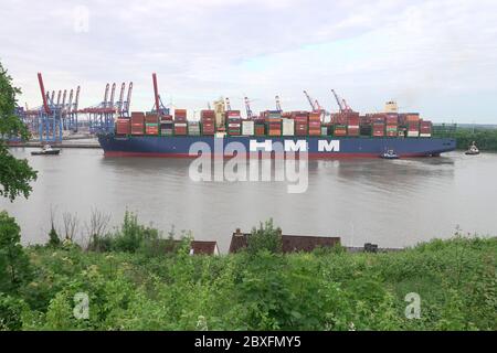 Hamburg, Germany. 07th June, 2020. The world's largest container ship 'HMM Algeciras' is entering the port of Hamburg on its maiden voyage. Credit: Bodo Marks/dpa/Alamy Live News Stock Photo