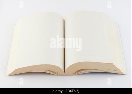 Open book with beige color pages isolated on white background Stock Photo