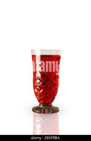 Red sweet refreshing drink in a glass, isolated on white Stock Photo