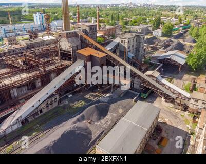 Aerial drone shot of old coke coal industrial zone with smoke stack. Air pollution concept. Stock Photo