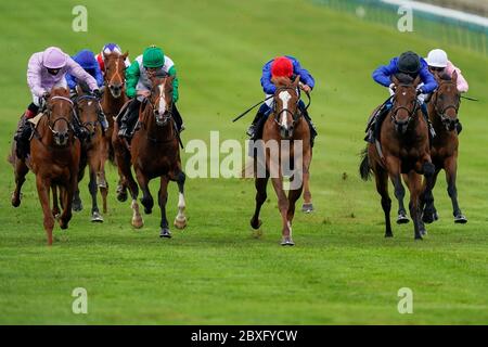 Mickael Barzalons riding Modern News (red cap) win The Watch Racing For Free On Betfair EBF Stallions Maiden Stakes from William Buick and Noble Dynasty (R, black cap) at Newmarket Racecourse. Stock Photo
