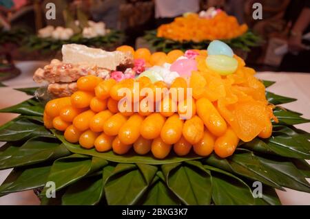 Thai Desserts called Med Kanun (Mung Bean Yolk) is Mung bean paste formed in egg yolk and sugar which is also popular snacks to accompany ceremonies. Stock Photo