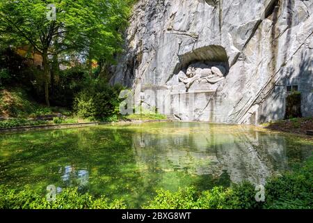 The Lion Monument in Lucerne, Switzerland, carved in a rock in year 1821, is an iconical landmark and symbol of the city Stock Photo