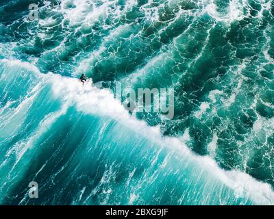 Aerial view of a surfer on the crest of  a wave, Barwon Heads, Bellarine Peninsula, Victoria, Australia Stock Photo