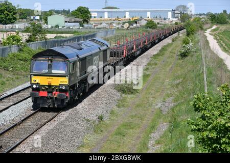 GB Railfreight Class 66 Diesel Electric locomotive 66779 Evening Star with a Scunthorpe Trent to Eastleigh East Yard long welded rail train 14 May 20 Stock Photo