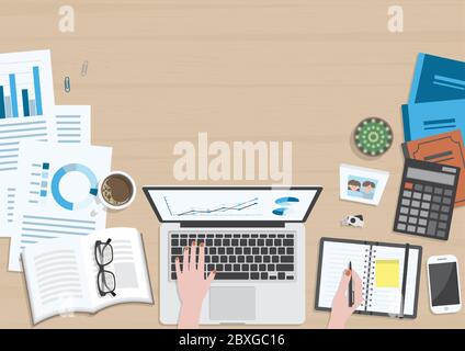 Wood textured desk from top view with hands of woman working on laptop computer and writing on organizer with office supplies, coffee mug, photo frame Stock Vector
