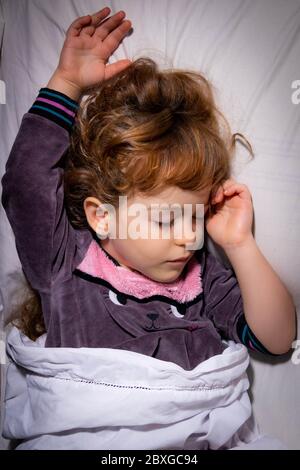 Overhead view of a girl sleeping in bed Stock Photo
