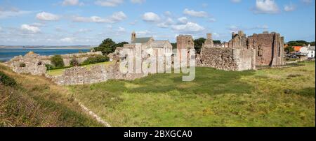 View across the ruins of Lindisfarne Priory on Holy Island in Northumberland, England Stock Photo