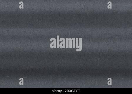 Brushed scratched metal texture. Polished stainless steel plate with light reflection. Stock Photo