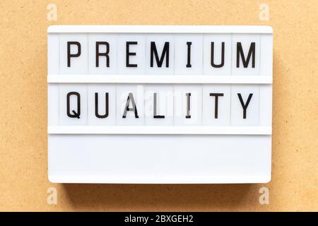 Lightbox with word premium quality on wood background Stock Photo