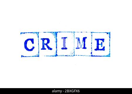 Blue ink of rubber stamp in word crime on white paper background Stock Photo
