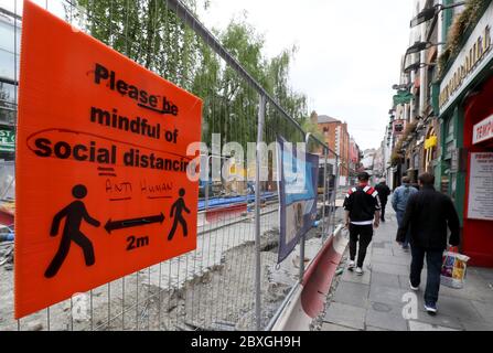 A social distancing sign in the Temple Bar area of Dublin. Businesses are preparing to reopen as phase two of Ireland's coronavirus recovery road map comes into effect on Monday 8th June along with other measures originally envisaged for later phases. Stock Photo