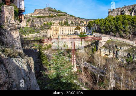 panoramic view of old monastery and metal bridge between precipices in the historic city of Cuenca. Spain Stock Photo