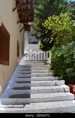 Stairs going up next to a house in historic old town of Nafplio, Greece. Stock Photo