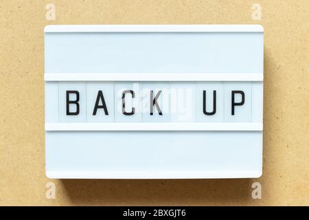 Lightbox with word back up on wood background Stock Photo