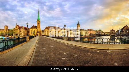 Panoramic view of Zurich city center Old town, Frauenkirche church and Limmat river, Switzerland, on dramatic sunrise Stock Photo