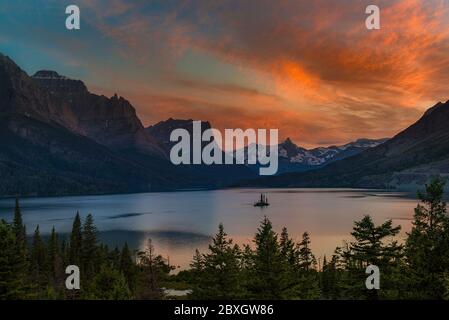 Beautiful colorful sunset over St. Mary Lake and wild goose island in Glacier national park Stock Photo