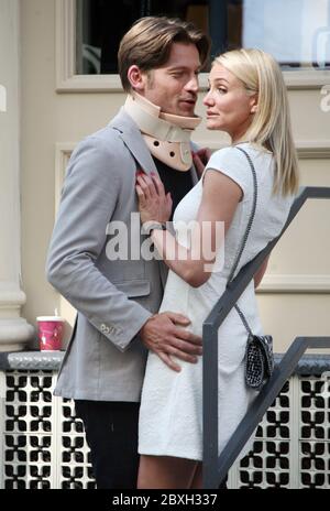 Cameron Diaz gives the 'middle finger' as she and Nikolaj Coster-Waldau get close as they film The Other Woman in New York City. 21 June 2013 Stock Photo