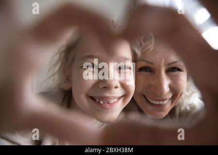 Portrait of grandmother and granddaughter make selfie together Stock Photo