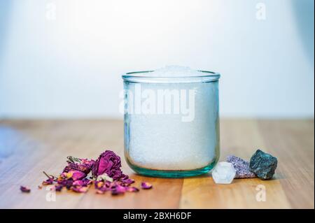 Rose petals with sea salt in recycled glass jar Stock Photo