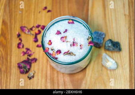 Rose petals with sea salt in recycled glass jar Stock Photo