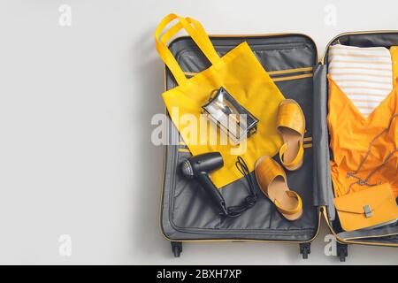 Open packed suitcase on white background Stock Photo