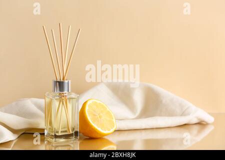 Citrus reed diffuser on table Stock Photo