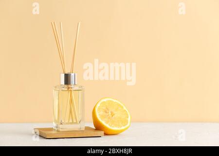 Citrus reed diffuser on table Stock Photo