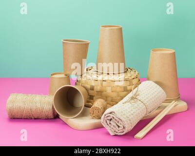 Subjects for kitchen natural materials on the turquoise and pink background. Ekostil. Stock Photo