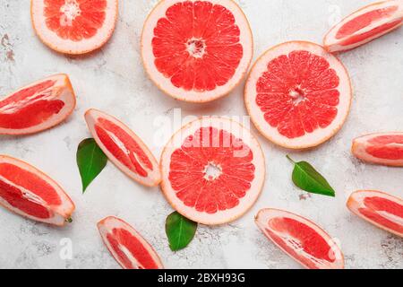 Fresh sliced grapefruit on light background Stock Photo