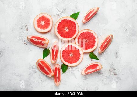 Fresh sliced grapefruit on light background Stock Photo