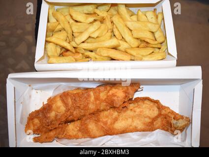 Classic fish and chips is Britain's national dish Large portion of battered white fillet with thick cut chips Professional chefs prefer haddock to cod Stock Photo
