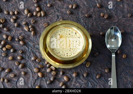 Indian Filter Coffee served in brass cup and saucer Stock Photo