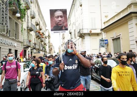 Peaceful protesters demonstrate against the death of George Floyd and all racial discrimination. Turin, Italy - June 2020