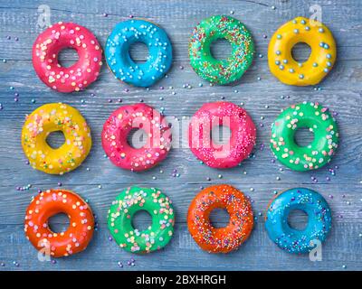 Colorful donuts on a wooden blue background Stock Photo