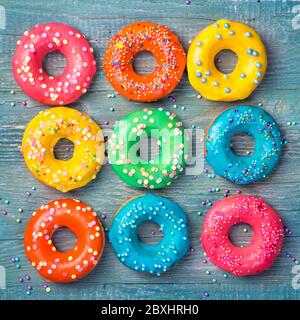 Colorful donuts on a wooden blue background Stock Photo