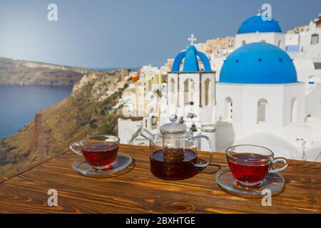 Morning tea against the backdrop of the architecture of the island of Santorini Stock Photo