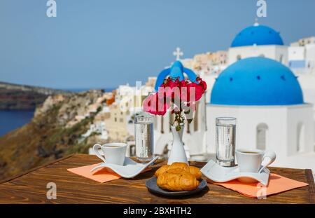 Coffee and Breakfast for two on the beach of Santorini Stock Photo