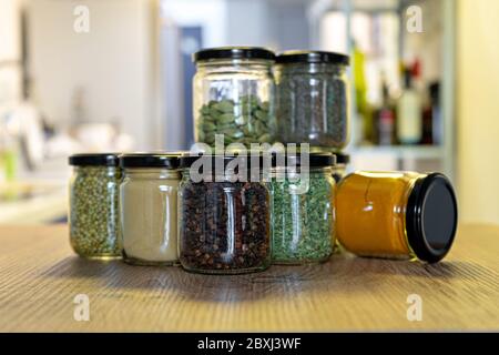 https://l450v.alamy.com/450v/2bxj3wf/spices-and-herbs-in-glass-jars-for-cooking-indian-spices-multi-colored-2bxj3wf.jpg