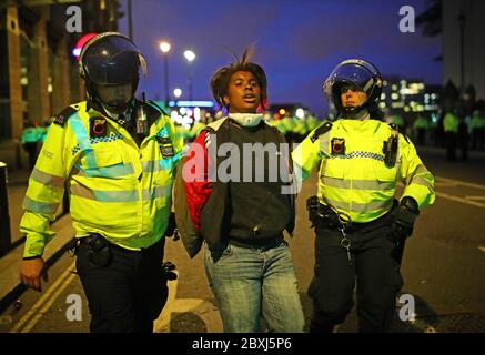 A protester is arrested by police in Whitehall, London, during a Black Lives Matter protest rally, in memory of George Floyd who was killed on May 25 while in police custody in the US city of Minneapolis. Stock Photo