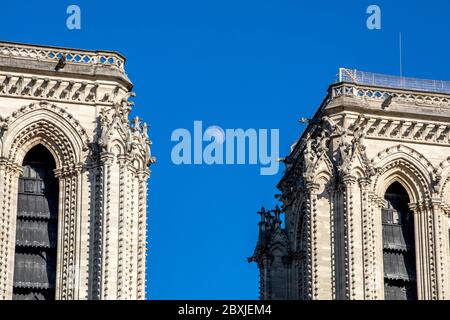 Paris, France - June 1, 2020: Beautiful view of the Notre-Dame Cathedral with a faint moon above it in Paris Stock Photo
