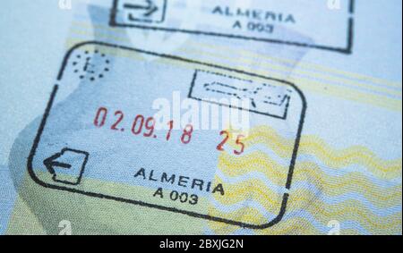 Entry stamp in passport made by immigration officer at border and visa control at Almeira airport in Spain. Selective focus. Macro photo. Stock Photo