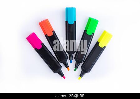 Five Colorful Markers On A White Background, Top View. Arranged in a semi circle with Open Caps. Stock Photo