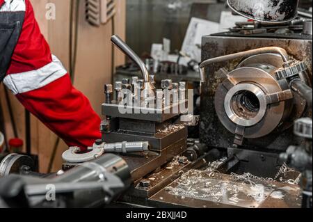 Master's hand. The old Metalworking machine, manufactured in the middle of the last century, is still in good condition. The use of old technologies i Stock Photo