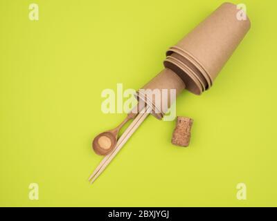 Kitchen accessories from ecological materials on a green background. Stock Photo