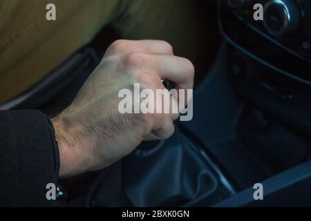 Man hand on gear lever Stock Photo