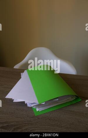 Closeup of sheets of paper on a wooden desk with copy space Stock Photo