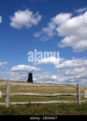 Beacon Mill windmill, standing in a field near the A259 at Rottingdean, East Sussex Stock Photo